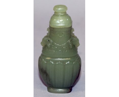 A CHINESE DARK GREEN CELADON JADE-LIKE MINIATURE VASE & COVER, of fluted archaic design, 3.3in high overall.