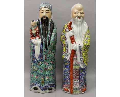 A PAIR OF EARLY 20TH CENTURY CHINESE FAMILLE ROSE PORCELAIN FIGURES OF FU XING & SHOU XING, Fu Xing holding a small boy and S