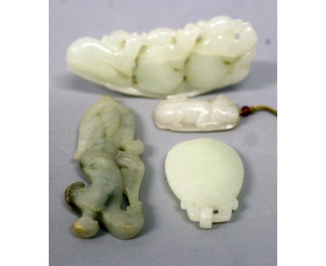 A CHINESE PALE CELADON JADE-LIKE MODEL OF THREE BOYS, seated on a narrow extended leaf, 3.3in wide; together with three other