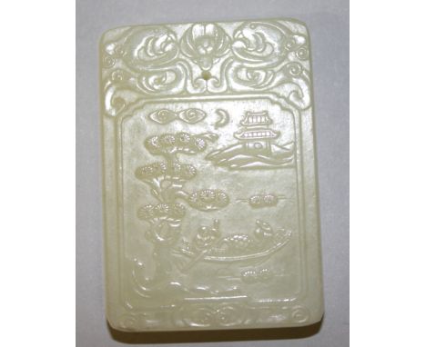 A CHINESE PALE CELADON JADE RECTANGULAR PENDANT, decorated in low relief to one side with a river landscape scene, the revers