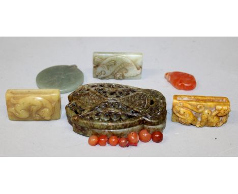 A CHINESE PIERCED JADE BOX & COVER, in the form of an archaically styled moth, 3.8in x 2.7in x 0.9in high; together with five