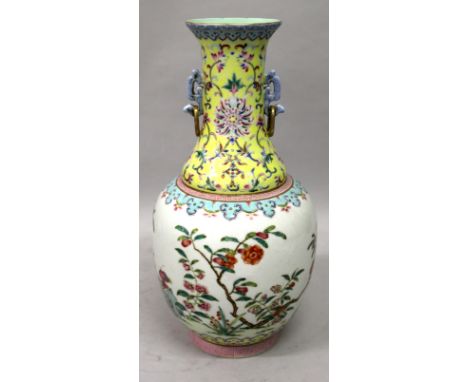 A GOOD QUALITY CHINESE FAMILLE ROSE PORCELAIN VASE, the sides decorated with garden foliage between formal borders, the neck 