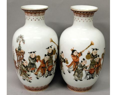 A MIRROR PAIR OF CHINESE PORCELAIN VASES, each decorated en grisaille, and in iron-red and gilding with calligraphy and a sce