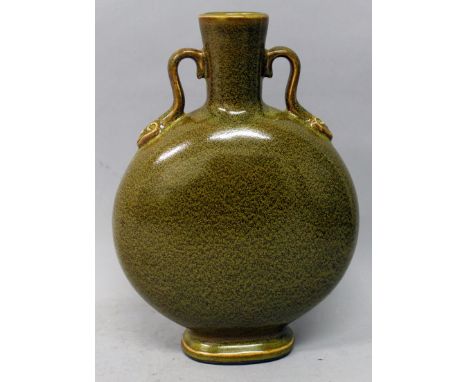 A CHINESE TEA DUST GLAZED PORCELAIN MOON FLASK, with double ruyi handles, the base with a Qianlong seal mark, 9.2in high.