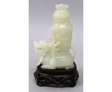 A CHINESE WHITE JADE-LIKE VASE & COVER, together with a fitted wood stand, the vase supported on the back of a mythical turtl