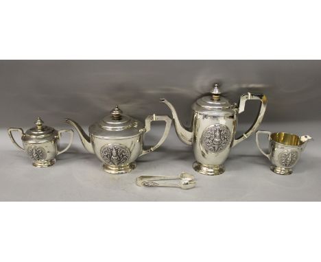 A GOOD EARLY 20TH CENTURY THAI SILVER TEA SET, in a fitted case, comprising a teapot with hinged cover, a coffee pot with hin