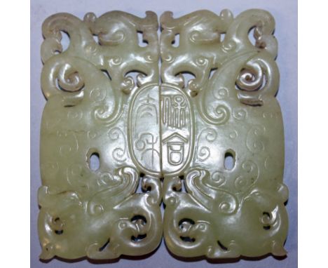 A PAIR OF CHINESE PIERCED CELADON JADE-LIKE PIERCED PLAQUES, joining together to form a seal mark to the centre and of archai