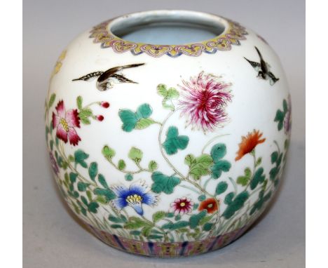 A CHINESE FAMILLE ROSE PORCELAIN JAR, the sides decorated with birds in flight above extended garden foliage, the base with a