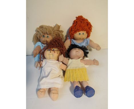 Four cabbage patch dolls 