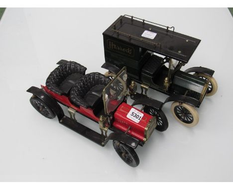 A vintage style Harrods tinplate Ford van and similar car