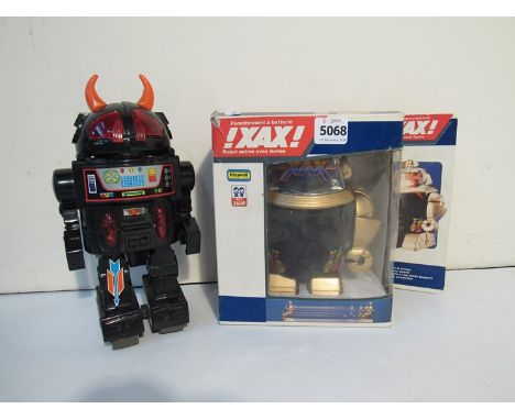 A boxed XAX robot and an unboxed Mike Toys robot 