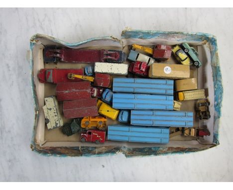 A quantity of pre-match box Lesney die cast toys including car transporters, Coca-Cola van, tow truck etc