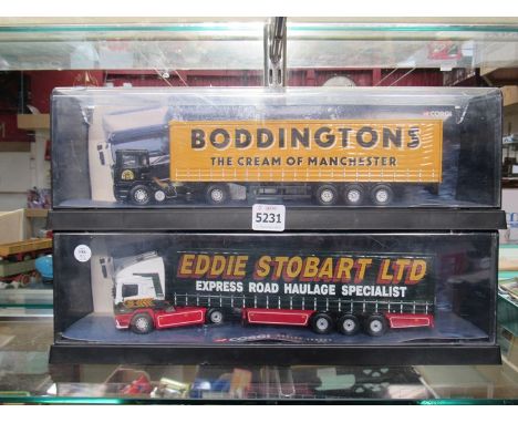 Two cased 1/50th scale trucks - Stobart and Boddingtons