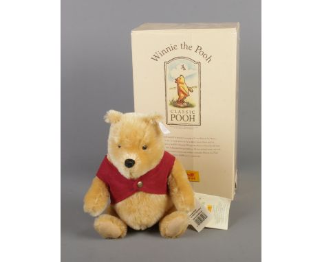 A boxed Steiff Classic Winnie The Pooh bear. Limited Edition 06,540/10,000.  