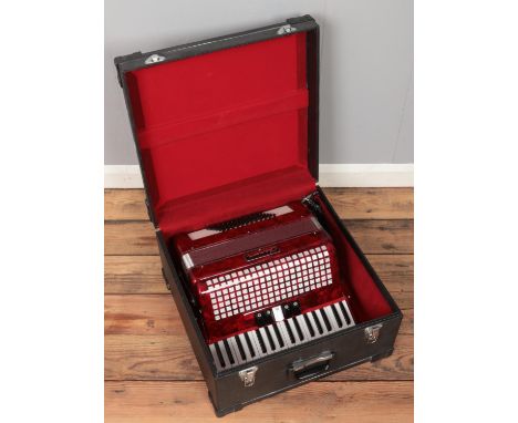 A Chanson accordion with carry case. Tone variation.  