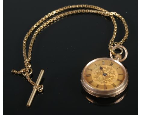 A 9ct manual fob watch featuring floral decoration along with yellow metal albert chain.  