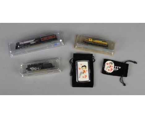 A matching Betty Boop lighter (working) and cigarette case along with three DelPrado diecast trains including C50, Royal Huds