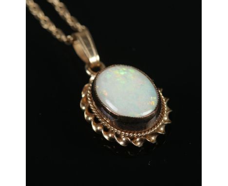 A 9ct gold opal pendant on chain. Gross weight 1.82g.  