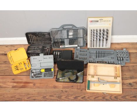 A quantity of cased tool sets including Speed Read clamps, Whitworth measure, auger set, drill bits, etc.  