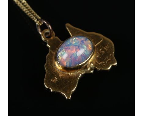 A 9ct gold pendant formed as Australia with central opal on 9ct gold chain. Gross weight 1.99g.  