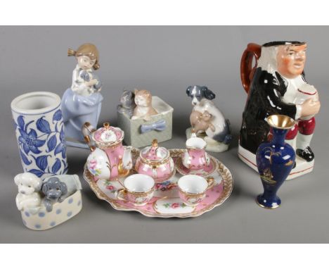 A quantity of ceramics. Including four Nao by Lladro figures, miniature teaset, character jug, etc.  