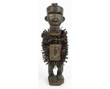 A Bakongo Nkisi Nkondi nail fetish figure from the Bantu People of The Democratic Republic of Congo, the standing figure with