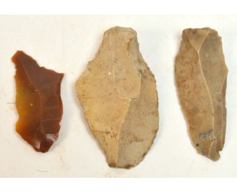 Three prehistoric flint axe heads/spear heads, length 6cm, 7cm and 7.5cm. CONDITION REPORT: Inherited by vendor, sadly no fur