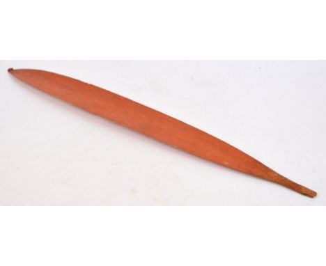 An early 20th century middle Australian Aboriginal woomera with bound "spike" to one tip and red pigmentation, length 84cm. C