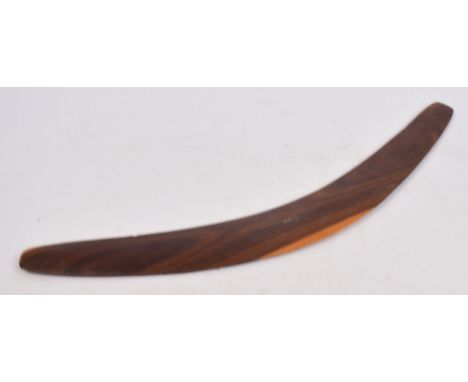 An Australian hardwood boomerang by BILL ONAS, length 61cm. CONDITION REPORT: The vendor was in Australia in 1964 and exchang