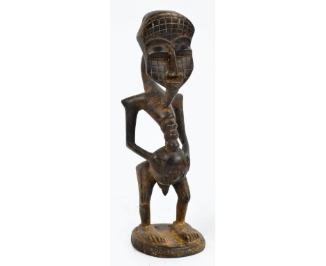 A Senufo (Poro) cult figure, Ivory Coast, height 44.75cm, width 12.5cm, depth 15cm.

This figure represents the spirit known 