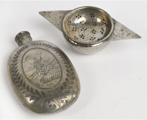 An early 20th century pewter oval hip flask engraved with an angler, with floral spray to the reverse, 12 x 8cm, and a pewter