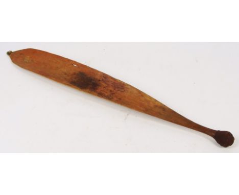 A late 19th century Aboriginal woomera with unusual markings to broad section which may be navigation tools, length 83cm.