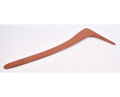 An early 20th century middle Australian Aboriginal club with fluted decoration to one side and red pigmentation, length 75cm.