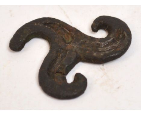 A Viking bronze triskelion belt mount, 2.5 x 2.5cm.