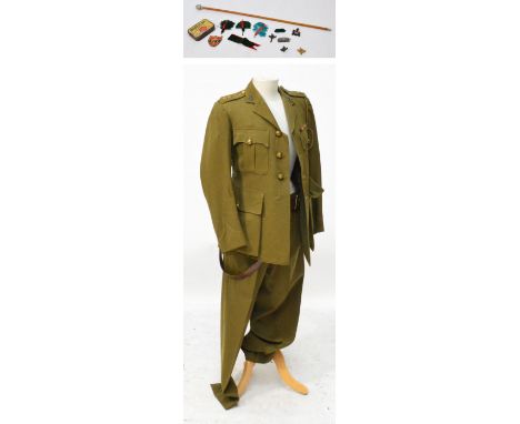 A WWII period jacket and trousers for The Northern Rhodesia Regiment, including Sam Browne belt, swagger stick and various ba