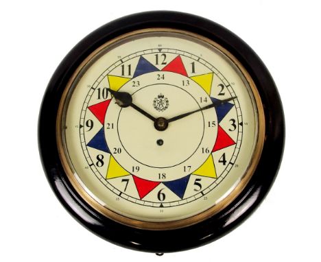 An early 20th century RAF sector wall clock, the stained circular frame centred with a painted dial centred with the RAF logo
