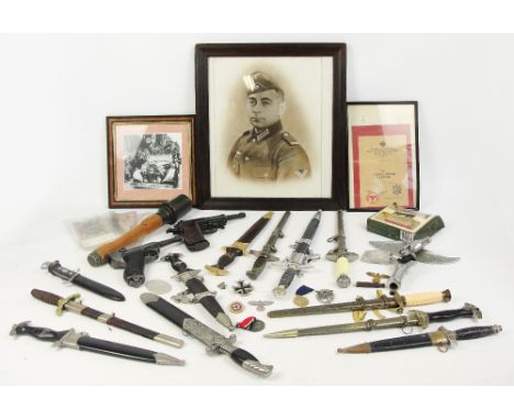 A collection of modern replica German daggers and pistols, etc (film props).