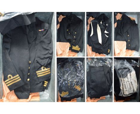 A black trunk containing a large quantity of naval uniforms including overcoat, evening mess dress, waistcoat, trousers, etc.