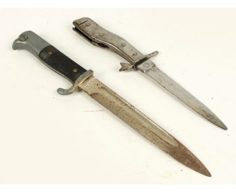 A German WWII period combat knife, the blade stamped "Demag, Duisberg" and a WWII bayonet (lacking scabbard) (2).