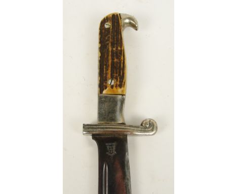 A German Third Reich antler handled RAD dagger, lacking scabbard, the blade stamped "Alcoso, Solingen".