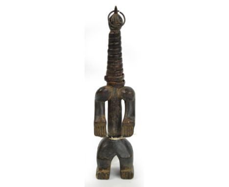 A Namji/Dowayo doll, Cameroon, the elongated neck with rattan binding and pierced ring loop through the cresting, height 33.5