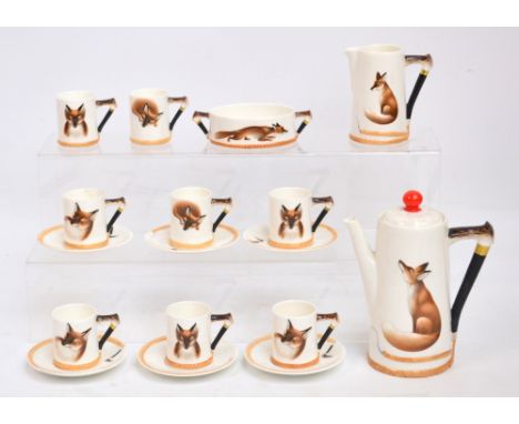 A Royal Doulton coffee service, H4927, transfer decorated with foxes and with hand painted handles modelled as horn handled w
