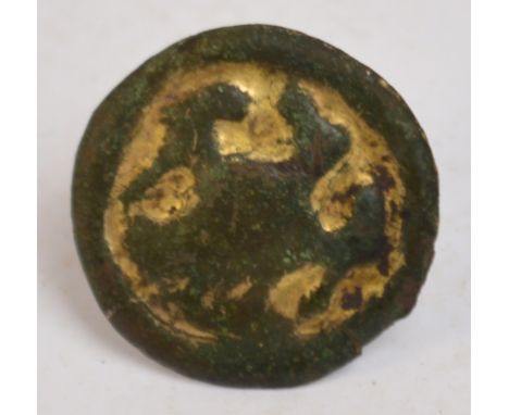 A Viking bronze circular pin with traces of gilt decoration, decorated with a falcon, diameter 2cm.