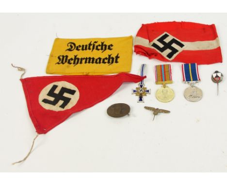 A mixed lot of German militaria including Third Reich arm band, service badge, enamel tie pin etc.