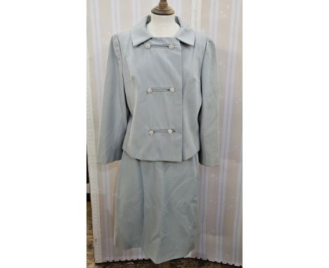 A 1950s/early 60s skirt suit, pale blue double breasted with double diamante fastening, with a straight skirt, a yellow satin