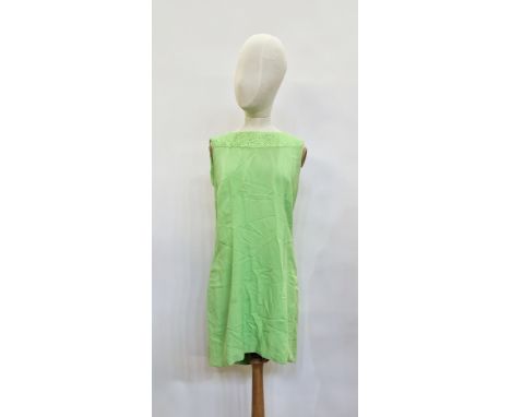 A lime green mini dress, curled ribbon detail to the bodice, scoop back with button and loop fastening, a 1940's brown crepe 