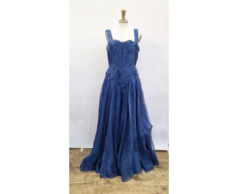 A vintage sequined bolero jacket in midnight blue, a 1950's blue evening gown, broad shoulder straps with full length chiffon