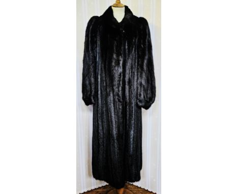 Full-length black ranch mink coat, labelled 'Konrad Furs, 42 Sloane Street, London, SW1', with a mandarin stand-up collar, ba