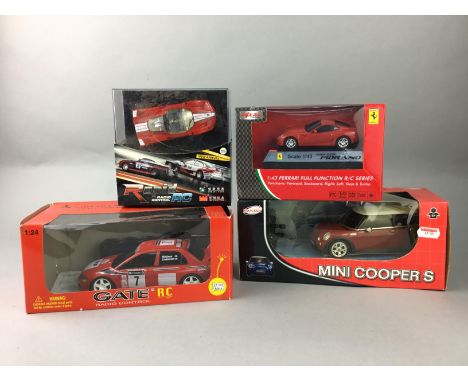 GATE RADIO CONTROLLED MITSUBUSHI LANCER, along with remote control and other model cars including a Rastar Mini Cooper S, a M