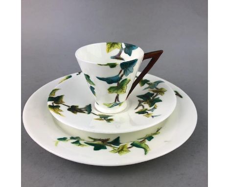 LATE VICTORIAN COFFEE AND TEA SERVICE, painted with leafy branches, comprising twelve plates, eleven saucers, twelve conical 